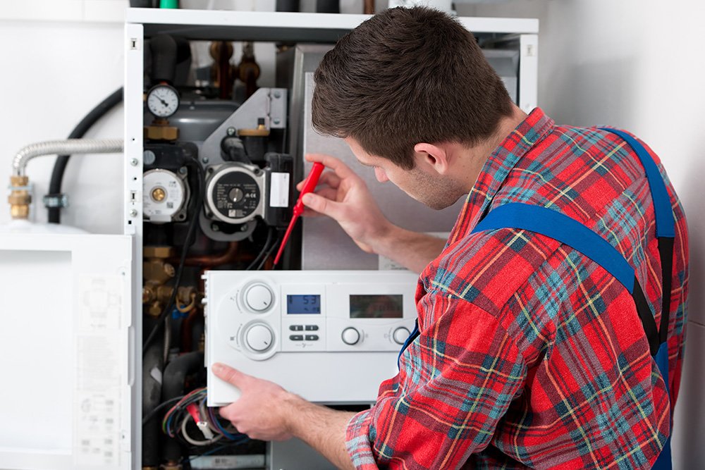 Gas Safe engineer servicing a home boiler